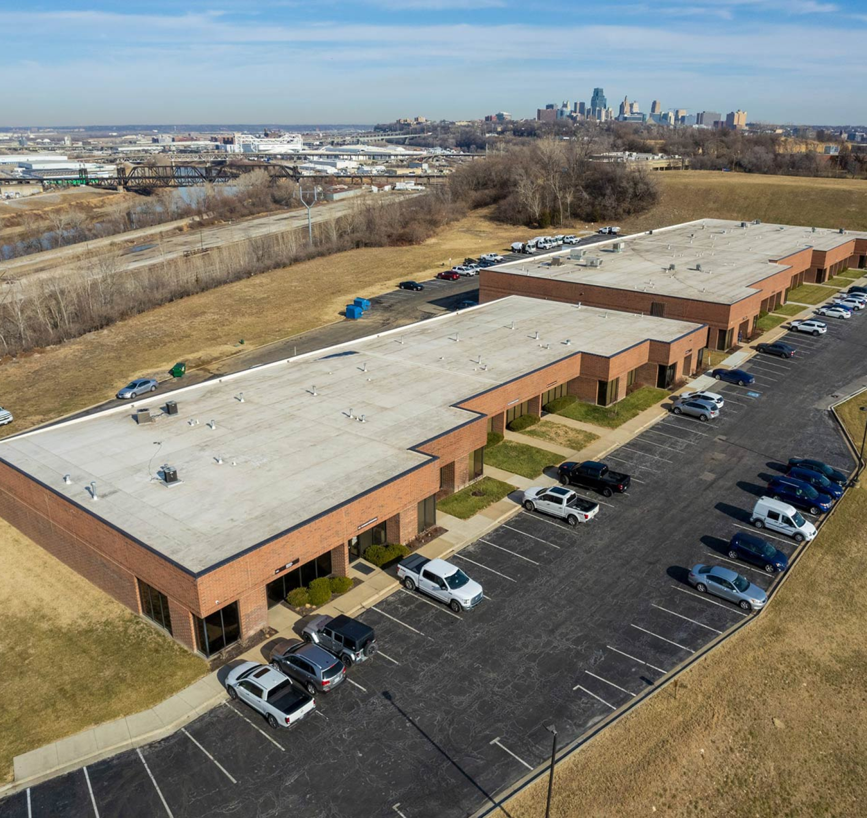 aerial view of the top of a building and a parking lot